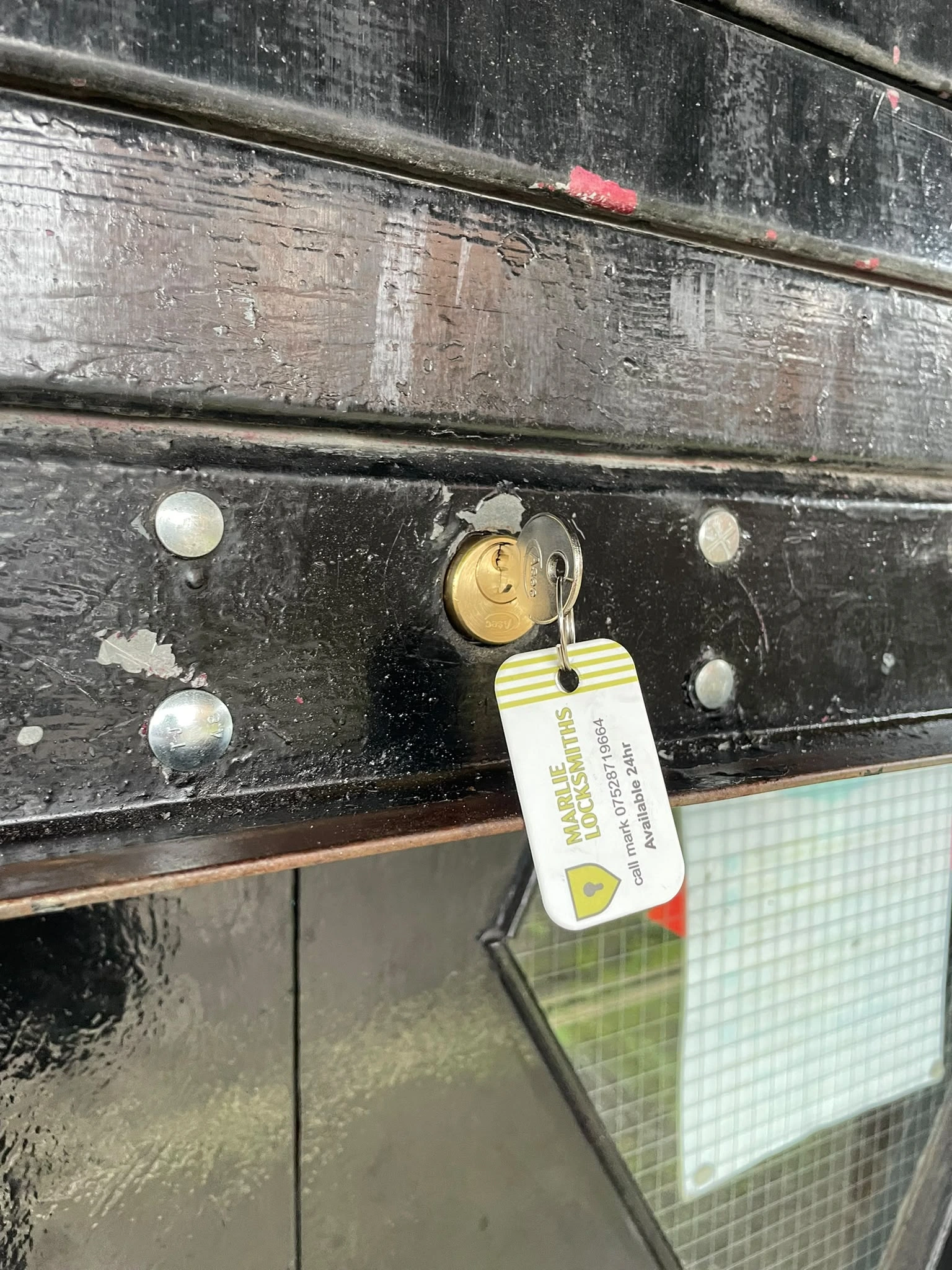 Heavy duty commercial roller shutter bullet lock fitted to an industrial unit in Irvine