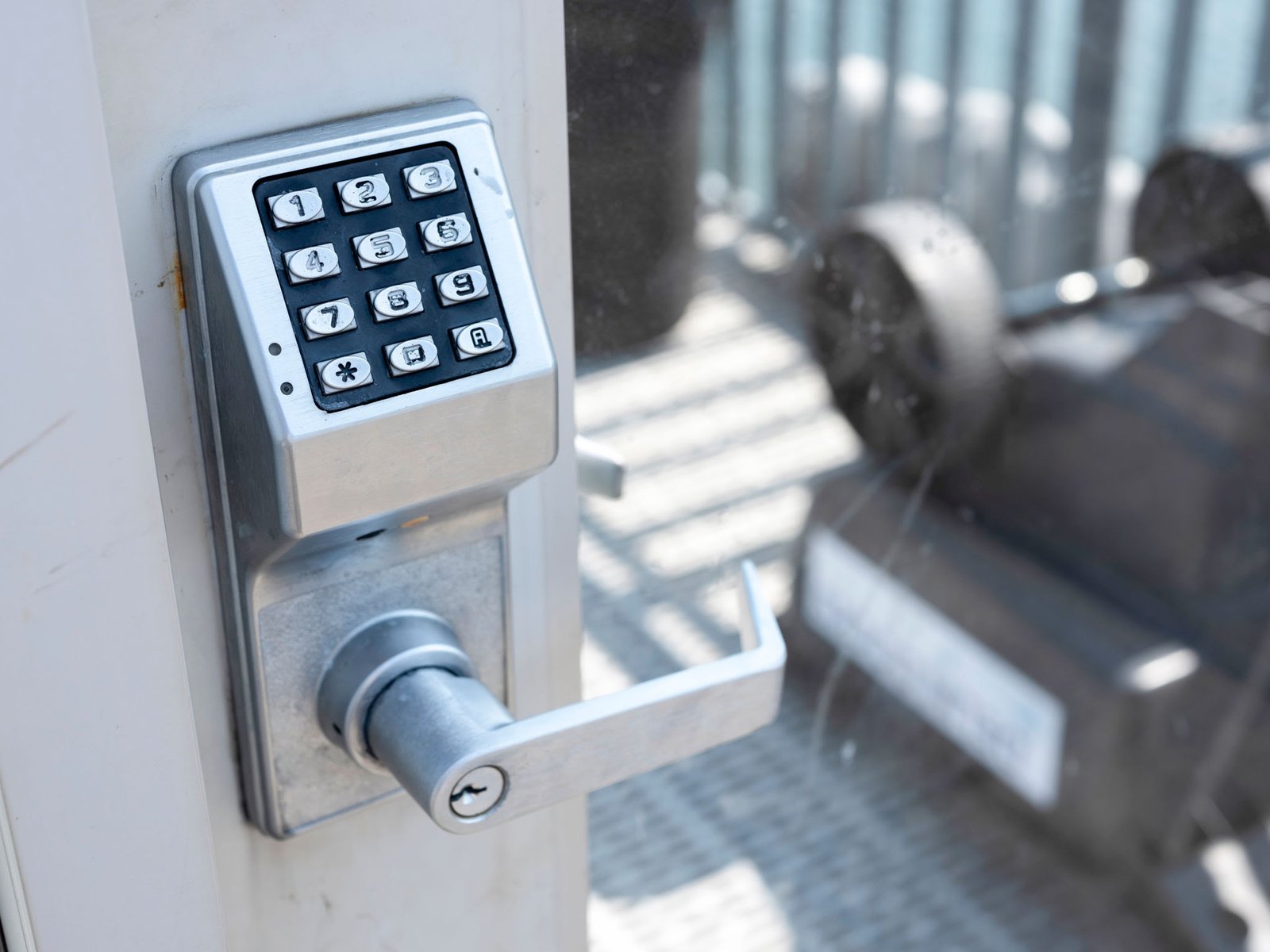 Commercial digital keypad access control lock installed on an office door